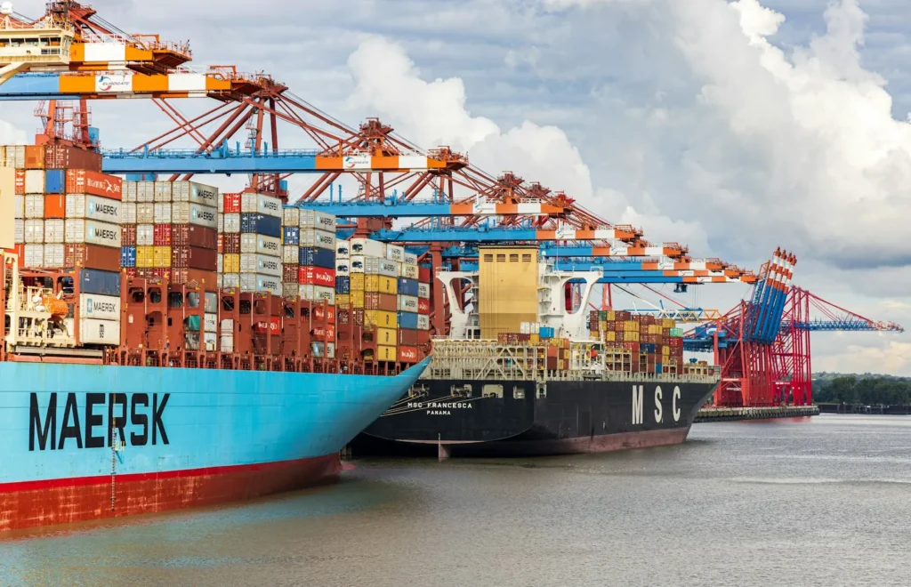 China tariff 2026: blue and red cargo ship on dock during daytime